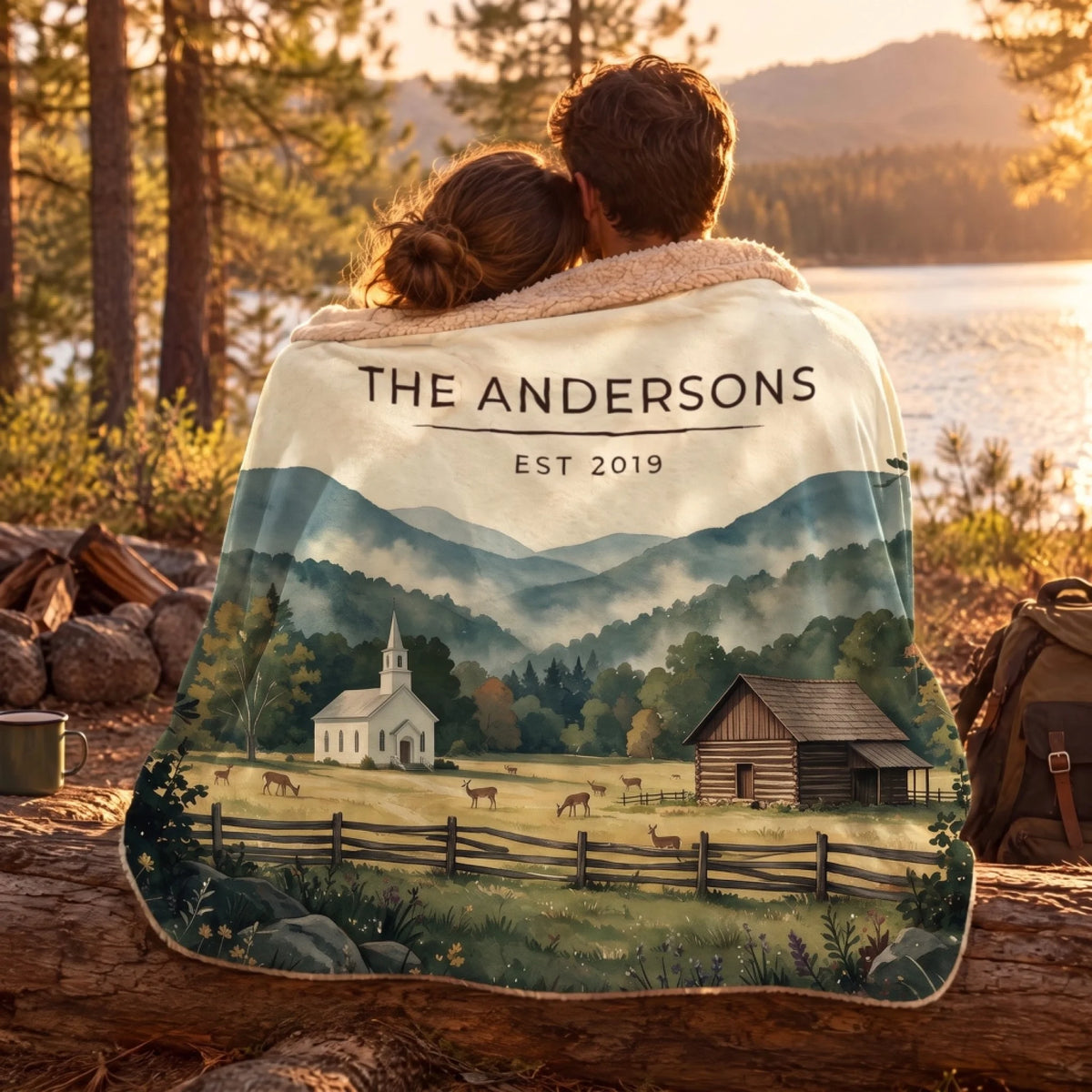 Couple wrapped in the Great Smoky Mountains Cades Cove Sherpa Blanket by a lake