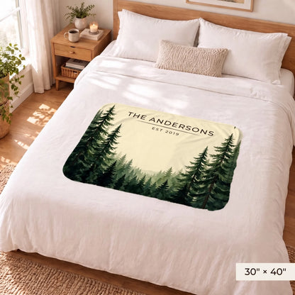 Evergreen Forest Treetops Sherpa Blanket 30x40 on a queen bed