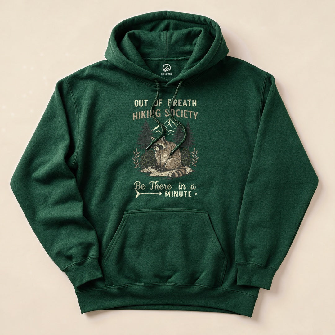 Forest Green Out of Breath Hiking Society Raccoon Hoodie with a funny raccoon hiking graphic