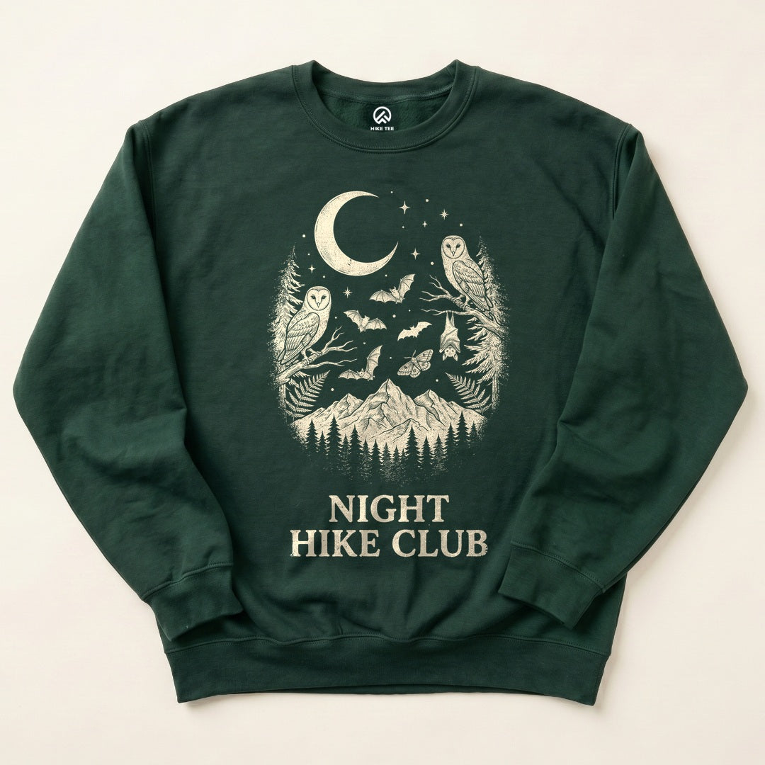 Forest Green Night Hike Club Sweatshirt with owls, bats and a crescent moon over the mountains graphic