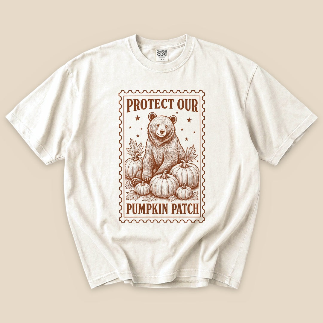 Ivory Protect Our Pumpkin Patch T-Shirt with a vintage bear guarding a pumpkin patch graphic