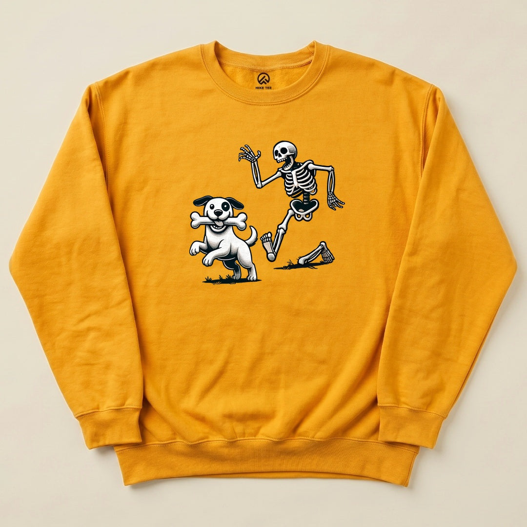 A yellow graphic sweatshirt featuring a playful skeleton and dog, with the dog holding a bone, showcasing the "Skeleton and Dog Halloween Sweatshirt" design.