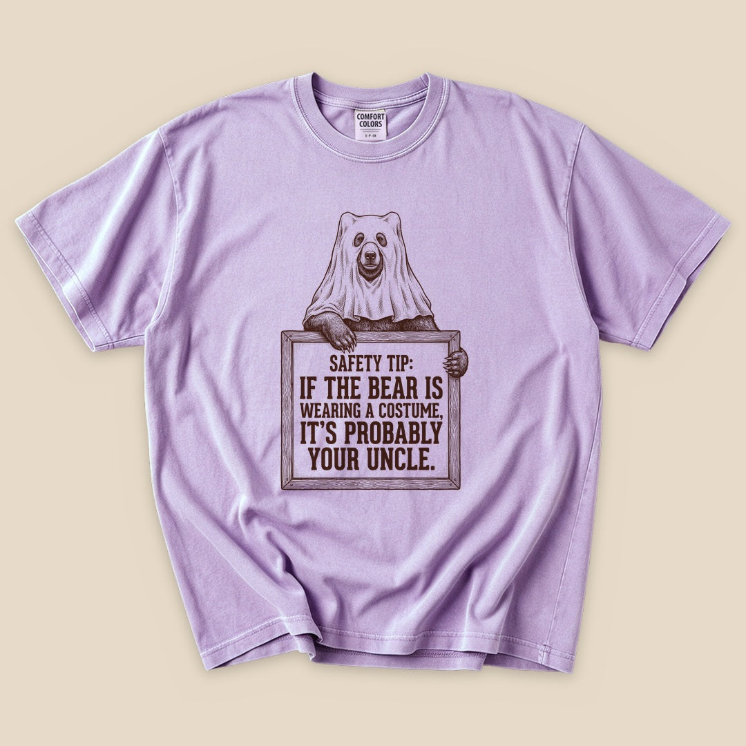 Orchid Bear Safety Tip T-Shirt with a bear in a ghost costume and a funny safety tip graphic
