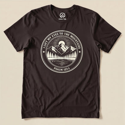 Brown I Lift My Eyes to the Mountains Shirt with a mountain lake badge with Psalm 121:1 graphic
