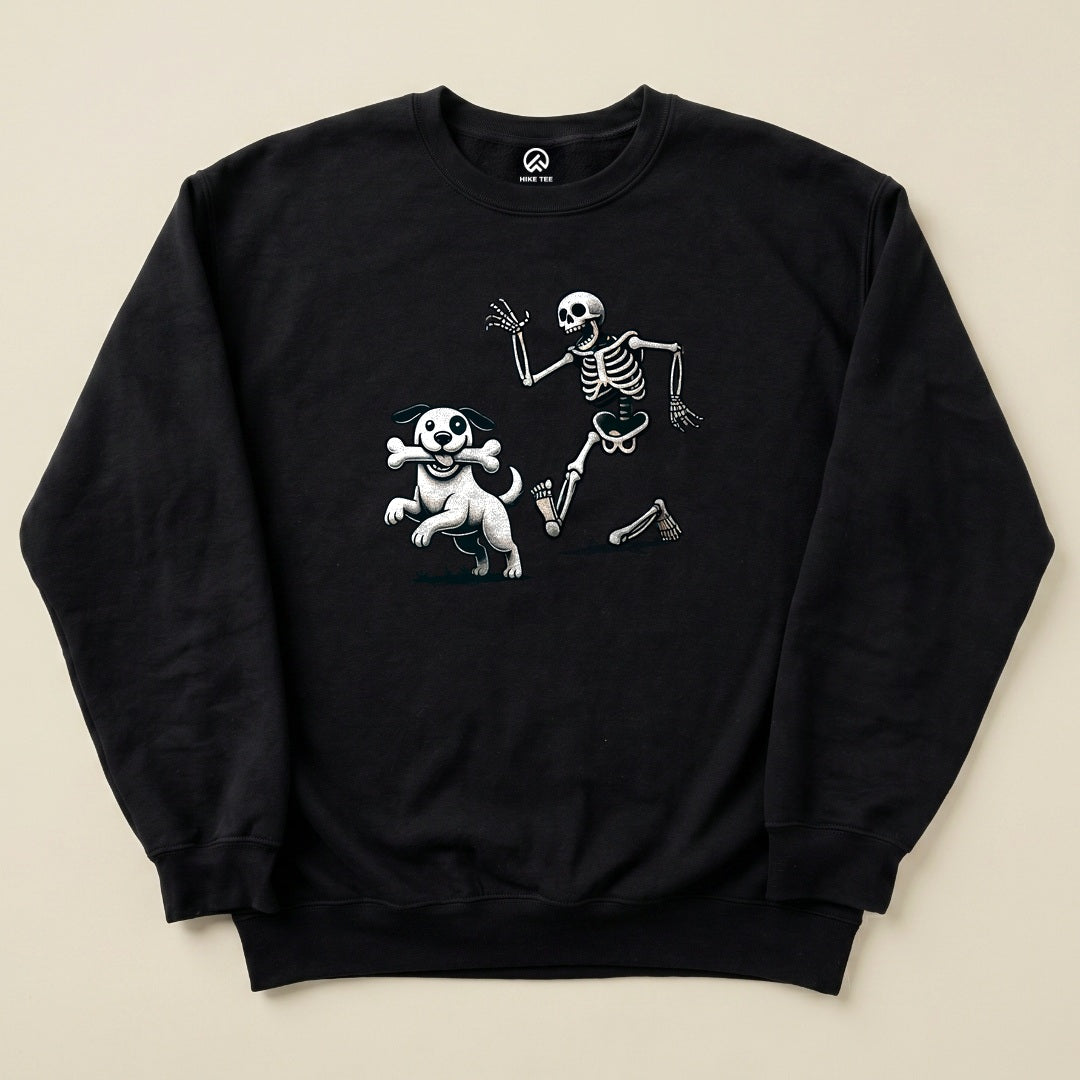A black graphic sweatshirt features a playful skeleton and a dog holding a bone, representing the "Skeleton and Dog Halloween Sweatshirt.