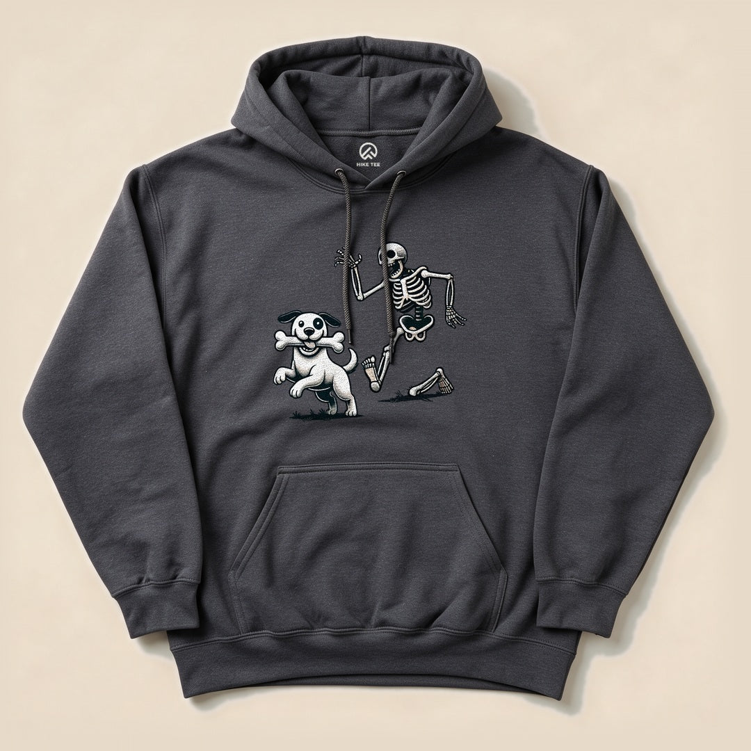 A dark gray hoodie featuring a graphic of a playful skeleton and a dog, titled "Skeleton and Dog Halloween Hoodie.