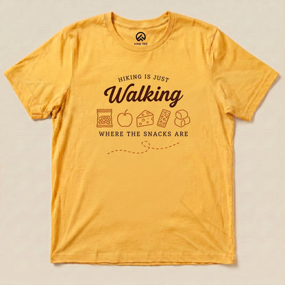 Yellow Gold Hiking Is Just Walking Where the Snacks Are Shirt with a trail snacks graphic