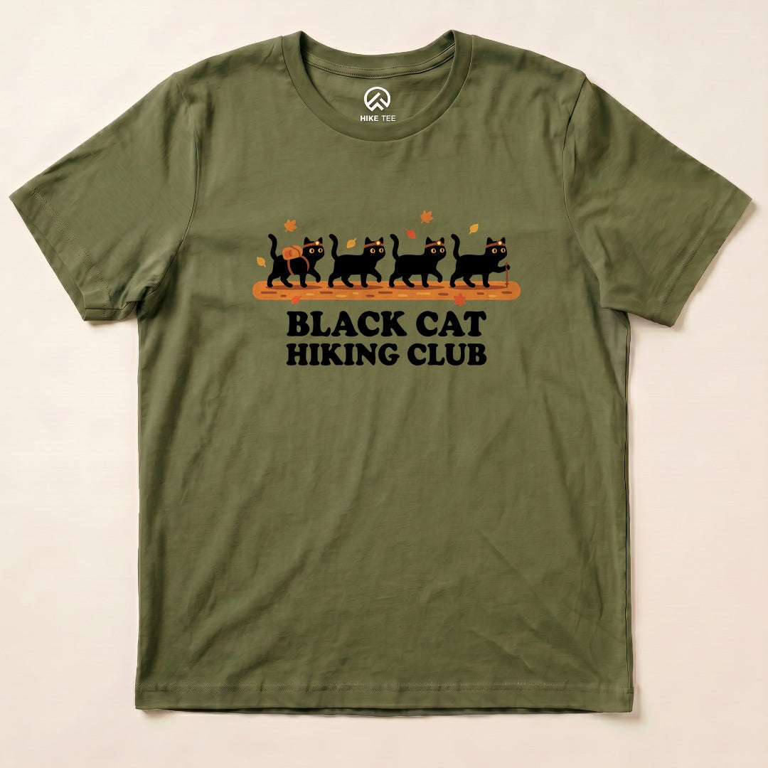 Military Green Black Cat Hiking Club Shirt with a row of black cats walking on a log with autumn leaves graphic