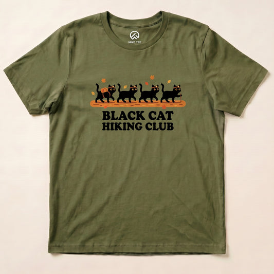 Military Green Black Cat Hiking Club Shirt with a row of black cats walking on a log with autumn leaves graphic