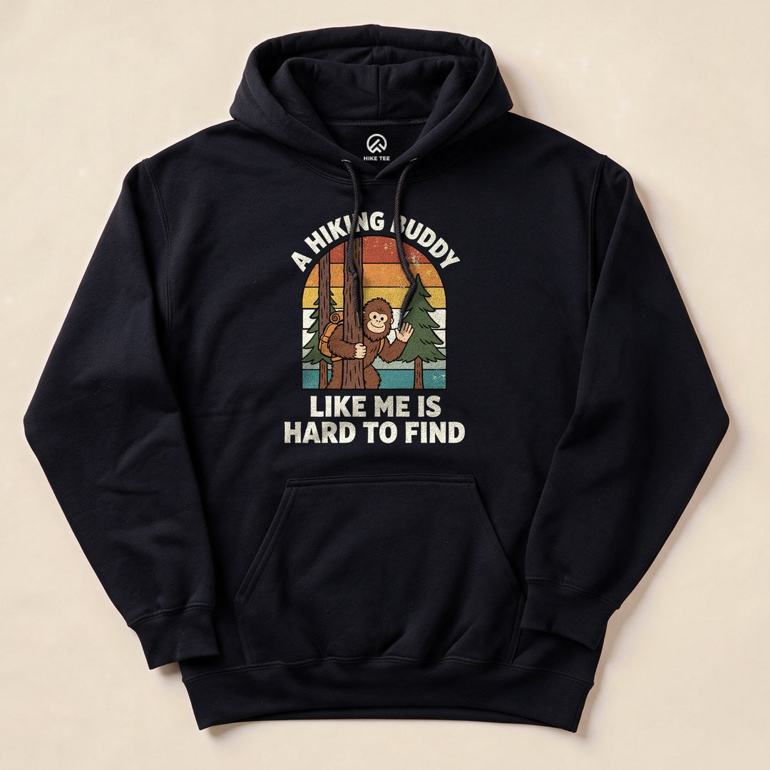 A navy hoodie featuring a graphic with a cheerful monkey holding a hiking stick, stating "A Hiking Buddy Like Me Is Hard To Find.