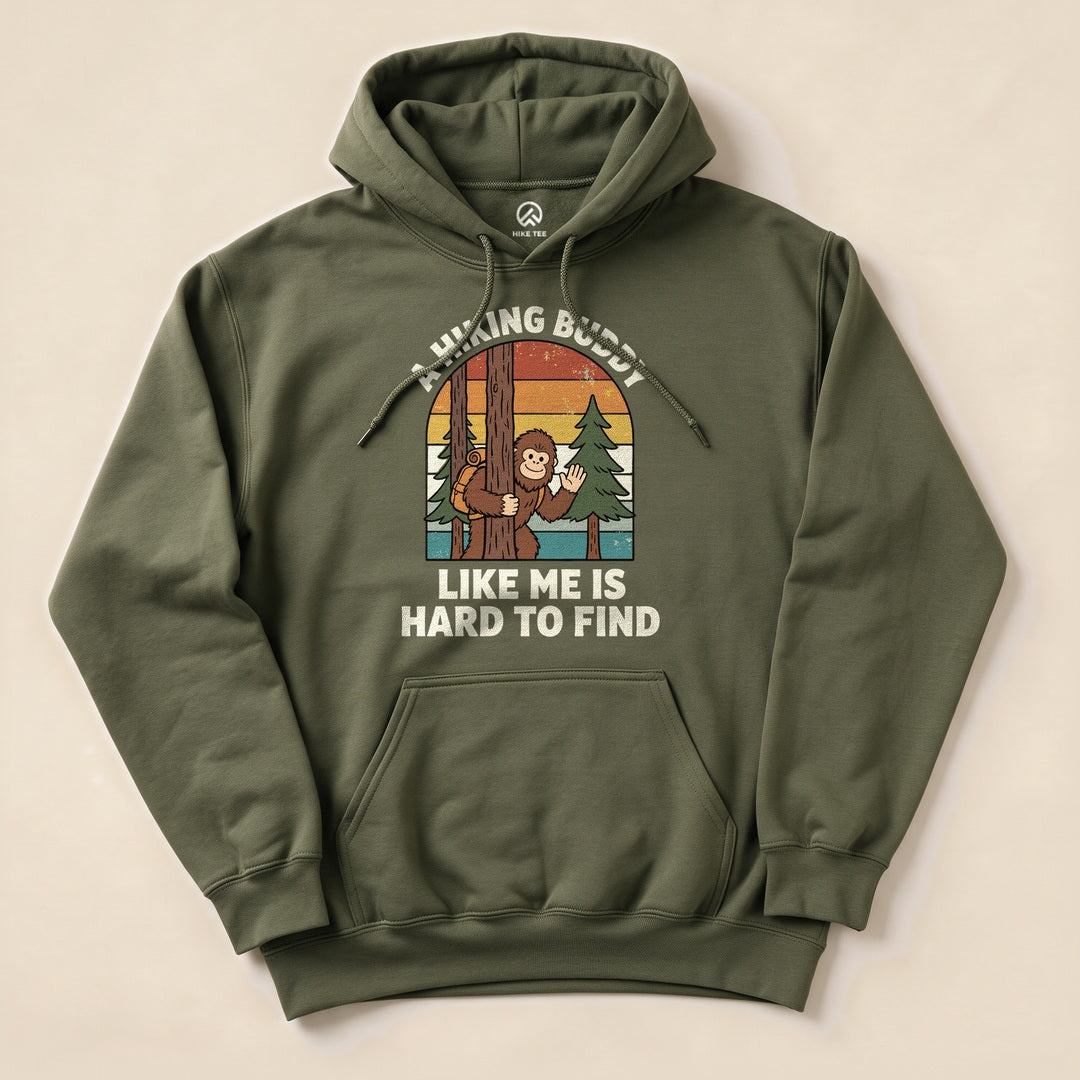 A graphic hoodie features a playful illustration of a monkey peeking from behind a tree with the text, "A Hiking Buddy Like Me Is Hard To Find.