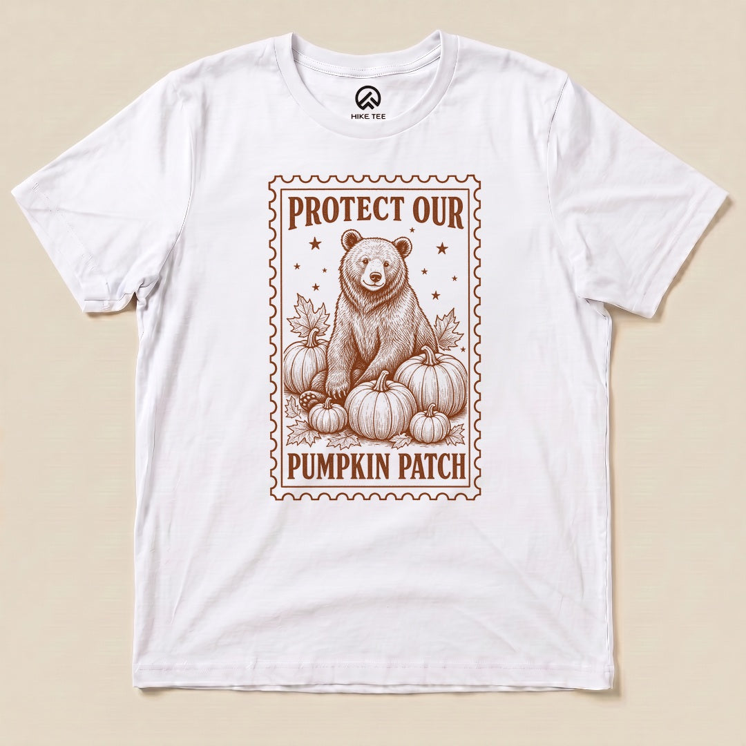 White Protect Our Pumpkin Patch Shirt with a bear among pumpkins in a vintage stamp frame graphic