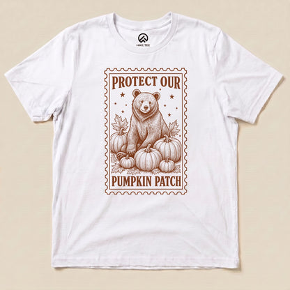 White Protect Our Pumpkin Patch Shirt with a bear among pumpkins in a vintage stamp frame graphic