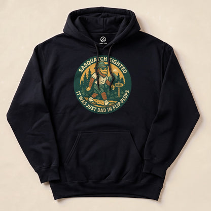 A black "Sasquatch Sighted Hoodie" features a humorous graphic of Sasquatch in flip-flops with the slogan, "It was just Dad in flip flops.