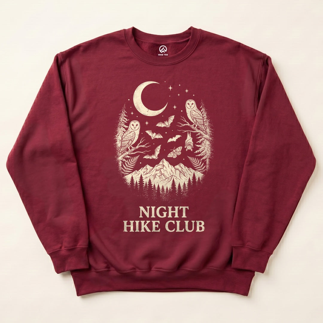 Maroon Night Hike Club Sweatshirt with owls, bats and a crescent moon over the mountains graphic