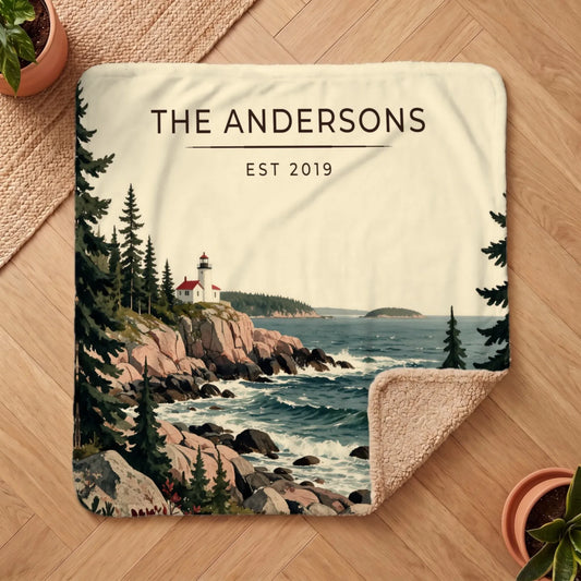 A cozy Acadia Lighthouse Coast Sherpa Blanket features a scenic lighthouse by the coast surrounded by lush trees and waves.