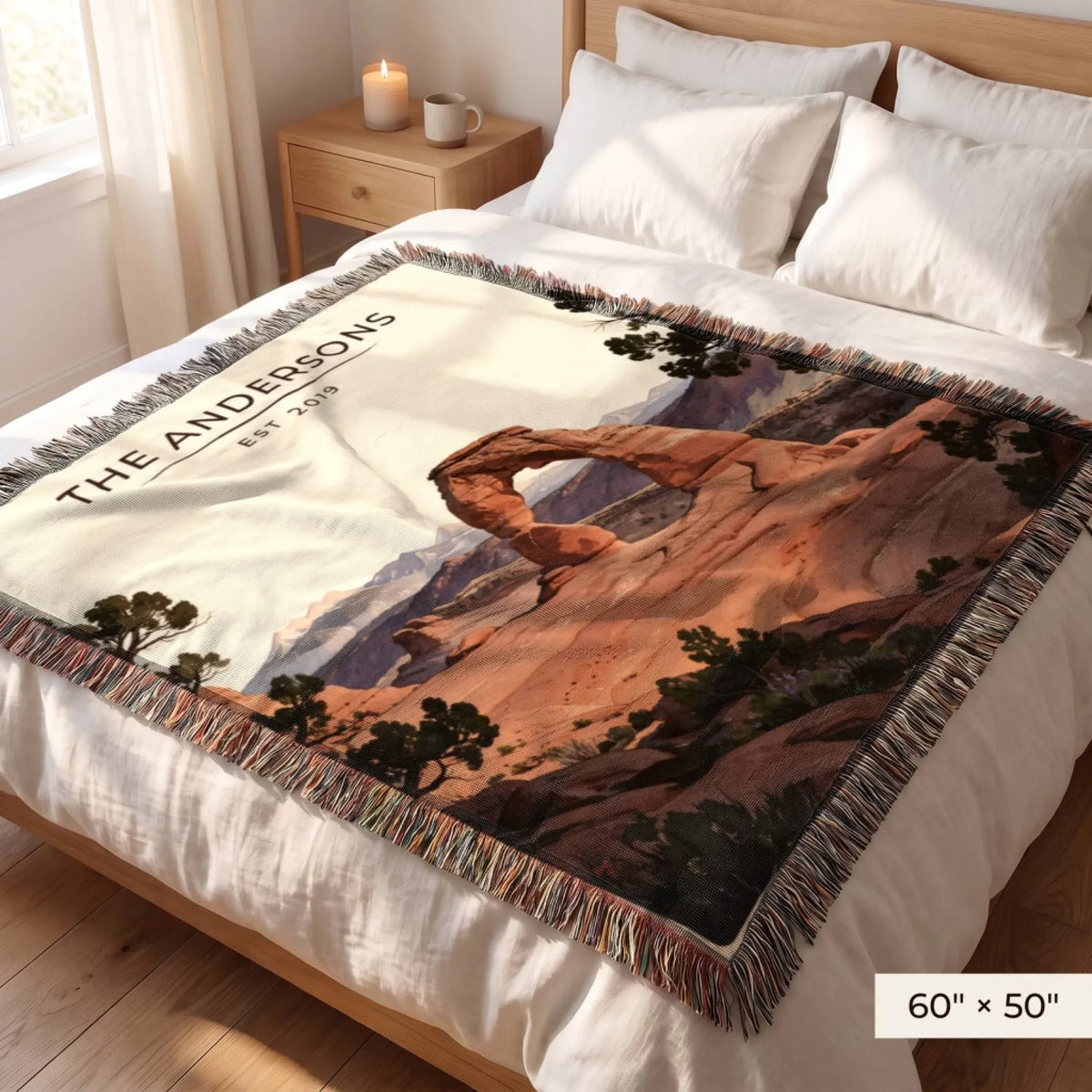 Arches Delicate Arch Sunset Woven Blanket 60x50 on a queen bed