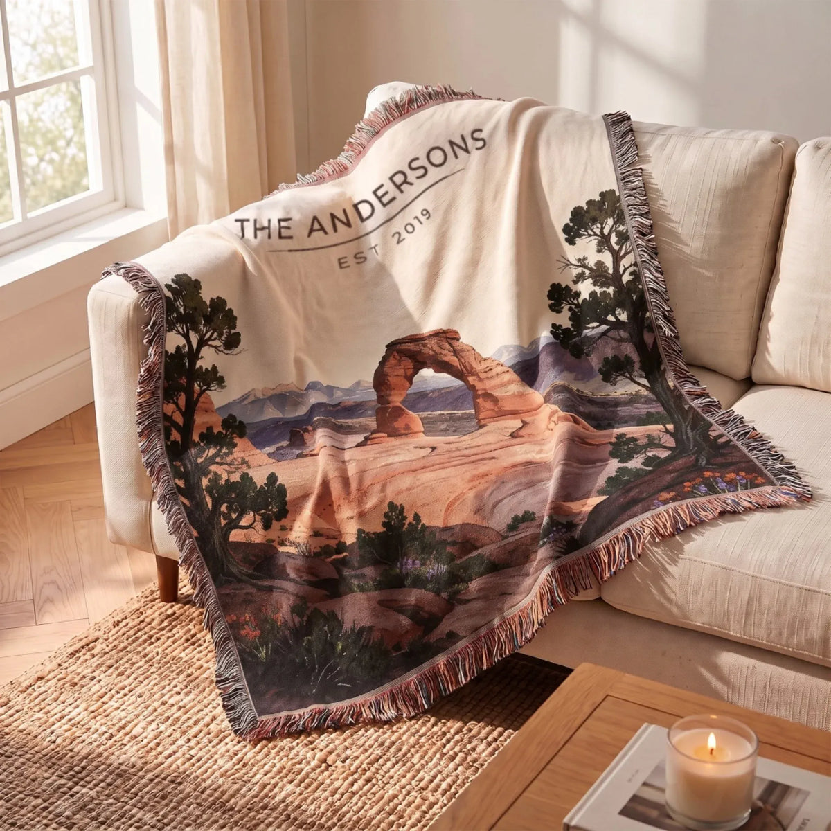 Arches Delicate Arch Sunset Woven Blanket draped over a sofa