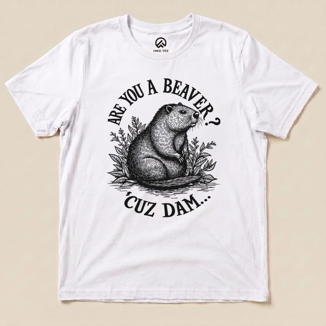 A graphic t-shirt features a beaver surrounded by foliage with the text "Are U A Beaver? Cuz Dam..." printed in bold.
