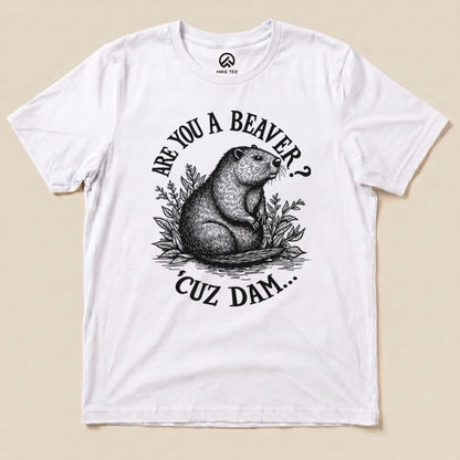 A graphic t-shirt features a beaver surrounded by foliage with the text "Are U A Beaver? Cuz Dam..." printed in bold.