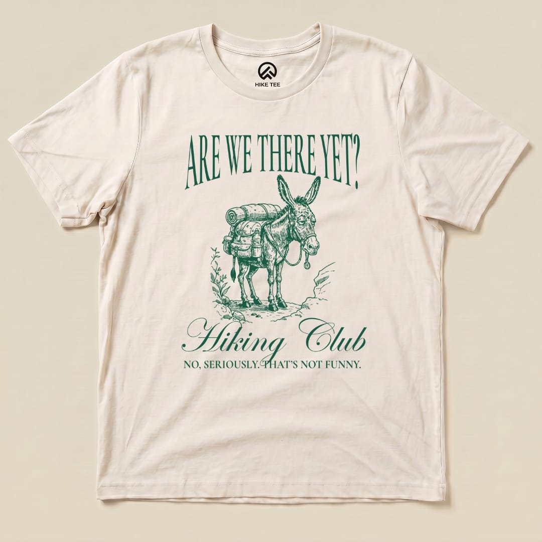 The "Are We There Donkey Club Shirt" features a playful donkey graphic with the text "Are We There Yet? Hiking Club" and a humorous tagline.