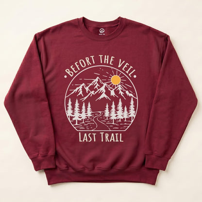 A maroon "Bachelorette Party Hiking Sweatshirt" featuring a mountain scene with the text "Before the Veil. Last Trail" printed boldly.