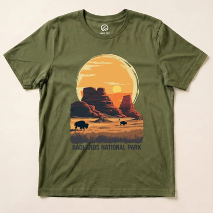 Graphic t-shirt featuring a sunset over Badlands National Park with bison and the text "BADLANDS NATIONAL PARK.