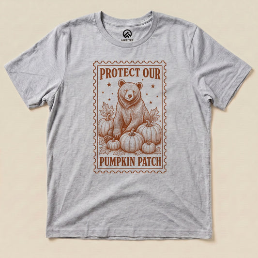 Athletic Heather Protect Our Pumpkin Patch Shirt with a bear among pumpkins in a vintage stamp frame graphic