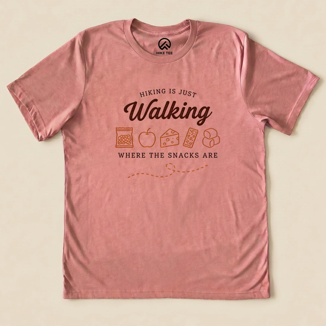 Heather Mauve Hiking Is Just Walking Where the Snacks Are Shirt with a trail snacks graphic