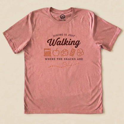 Heather Mauve Hiking Is Just Walking Where the Snacks Are Shirt with a trail snacks graphic