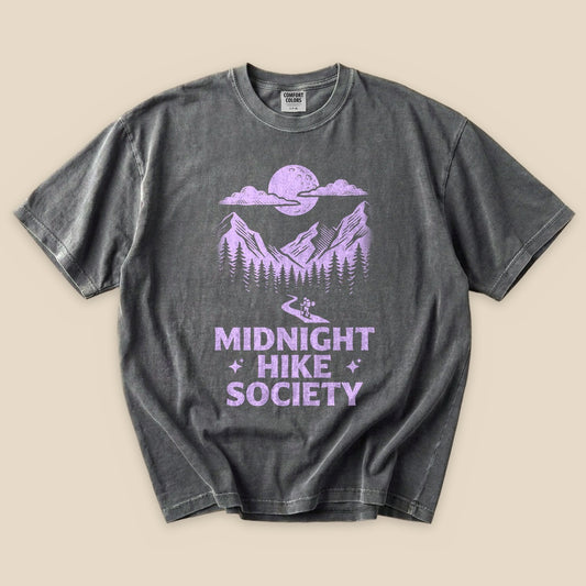 Pepper Midnight Hike Society T-Shirt with a purple moon over misty mountains graphic