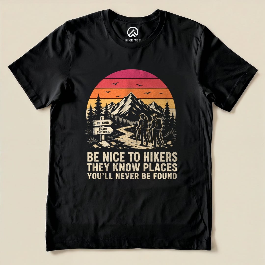 The "Be Nice To Hikers Sunset Shirt" features a colorful graphic of a sunset, mountains, and two hikers with the slogan below.