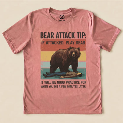 The "Bear Attack Tip Retro Shirt" features a humorous graphic of a bear looming over a person playing dead, with bold text.