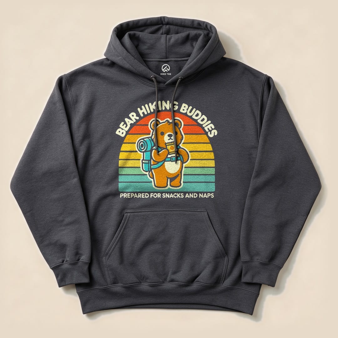 A dark hoodie featuring a cartoon bear with a backpack, text reading "Bear Hiking Buddies" and "Prepared for Snacks and Naps.