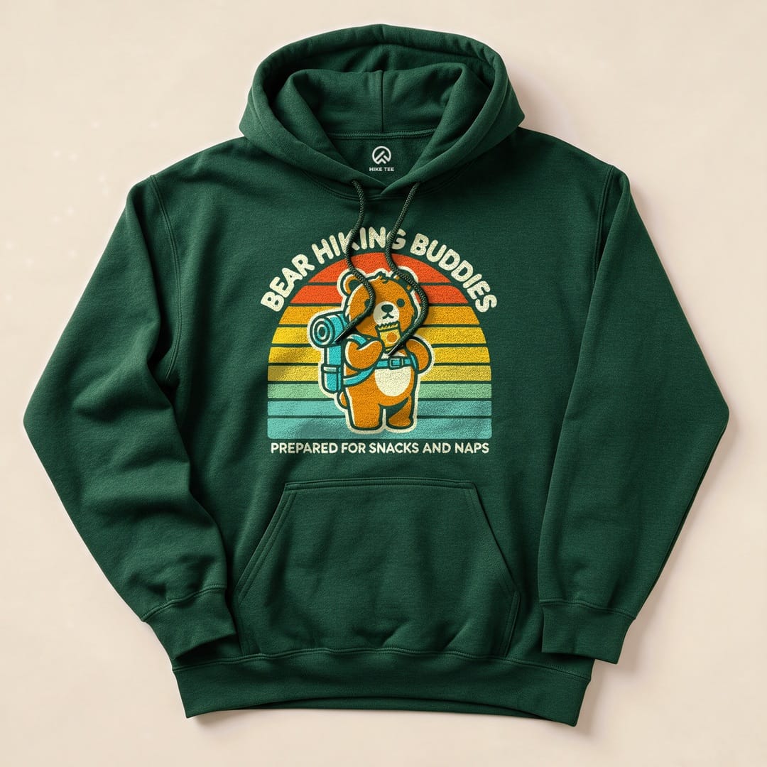 A green hoodie featuring the text "BEAR HIKING BUDDIES" and a graphic of a bear with a backpack, labeled "PREPARED FOR SNACKS AND NAPS.