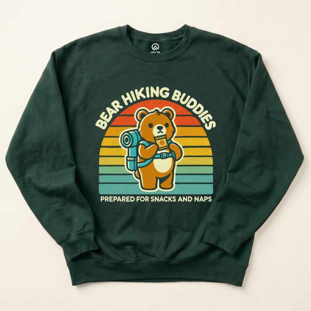 A flat lay of the Bear Hiking Buddies Sweatshirt featuring a cartoon bear with a backpack and the text "Prepared for Snacks and Naps.