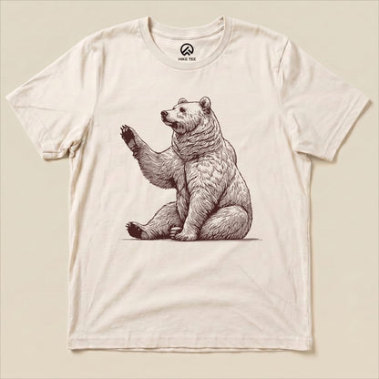 A graphic t-shirt featuring a waving bear illustration, labeled as the "Bear is Watching Shirt," displayed flat.