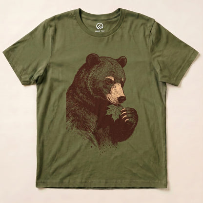 A graphic t-shirt featuring a bear holding a leaf, titled "Bear With Leaf Shirt," displayed flat on a light background.