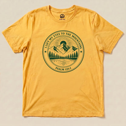 Yellow Gold I Lift My Eyes to the Mountains Shirt with a mountain lake badge with Psalm 121:1 graphic