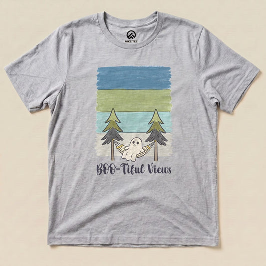 Athletic Heather Boo-tiful Views Shirt with a ghost relaxing in a hammock between pine trees graphic