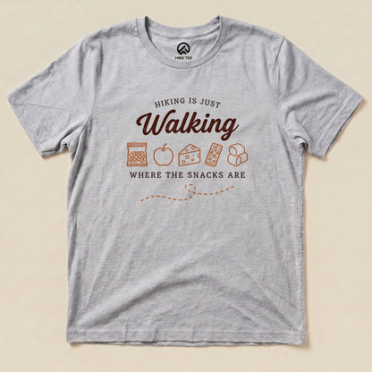 Athletic Heather Hiking Is Just Walking Where the Snacks Are Shirt with a trail snacks graphic