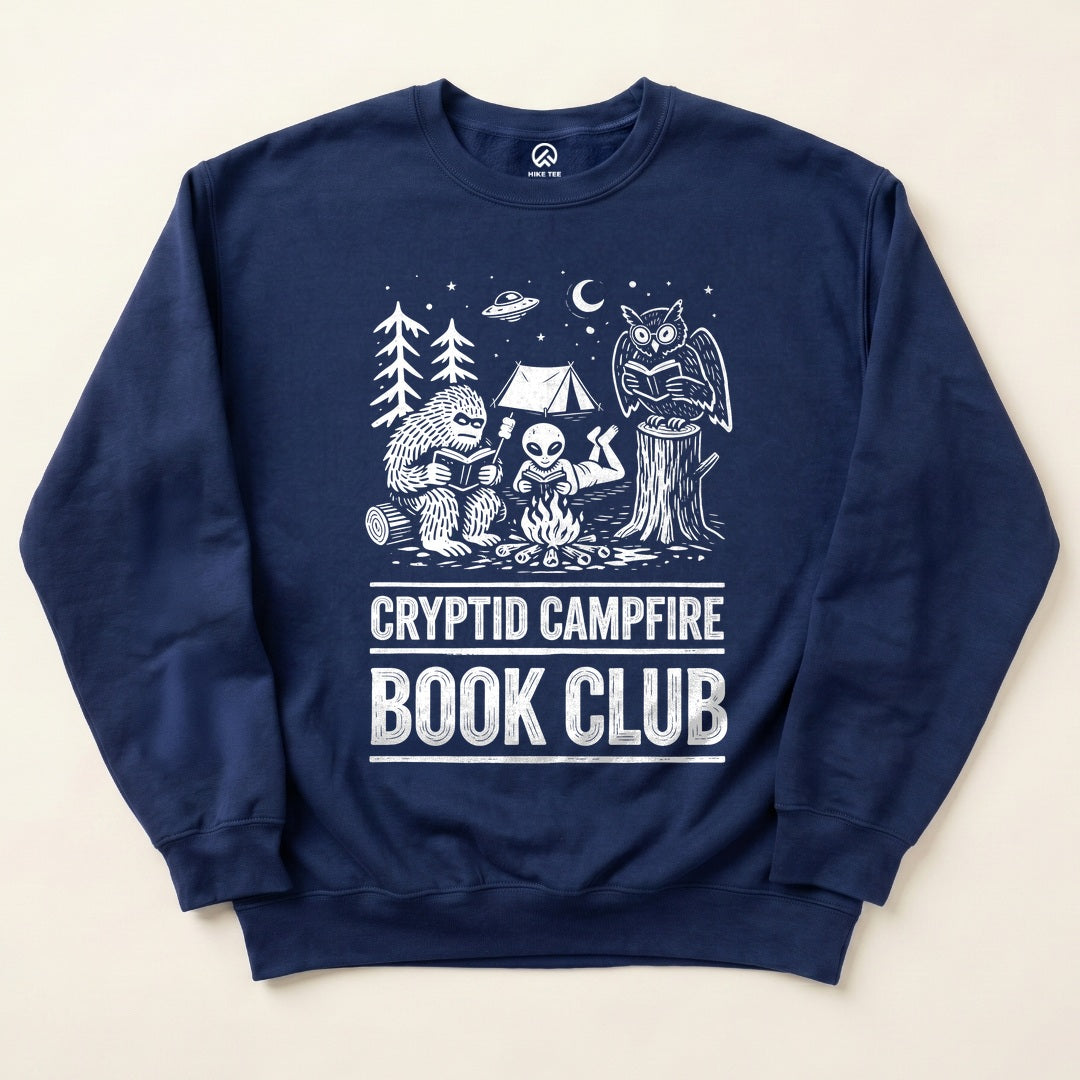 Navy Cryptid Campfire Book Club Sweatshirt with a Bigfoot and friends reading around a campfire graphic