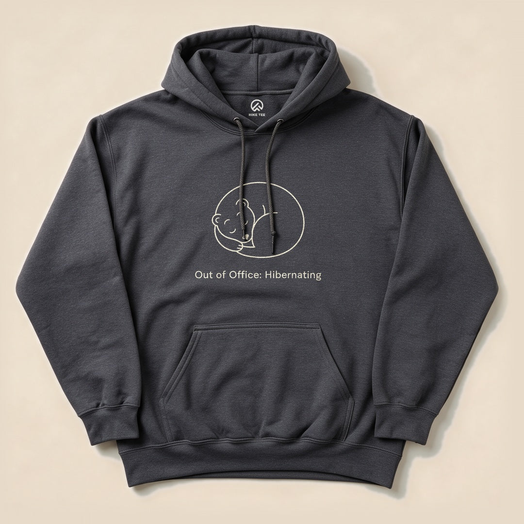 Dark Heather Out of Office Hibernating Hoodie with a sleeping curled-up bear line art graphic