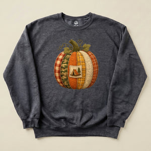 A "Camp Pumpkin Sweatshirt" featuring a decorative pumpkin design with various textures and a small camping scene graphic.