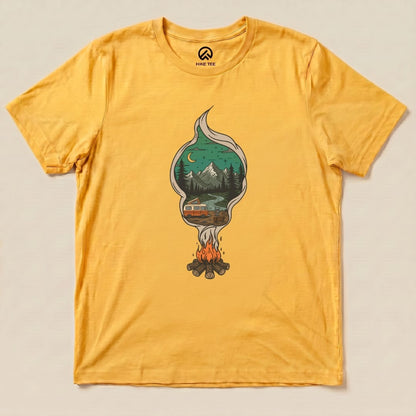 A graphic t-shirt in yellow featuring a campfire design with mountains, trees, and an orange camper under a starry sky, labeled "Campfire Smoke Shirt.
