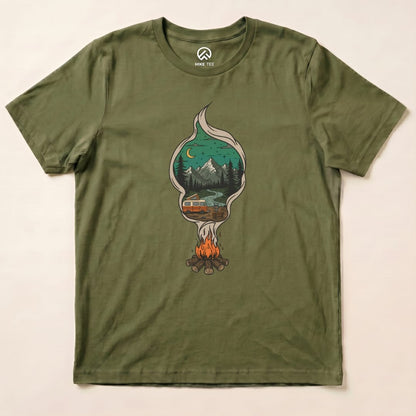 The Campfire Smoke Shirt features a graphic of a campfire surrounded by mountains and a cabin, printed on an olive green t-shirt.
