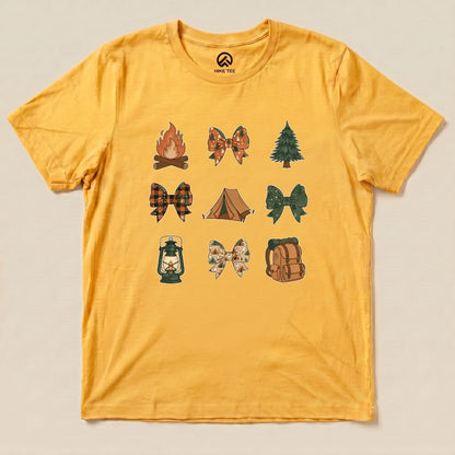 A yellow graphic t-shirt features various camping-themed bows, including a campfire, tent, and lantern, labeled as the "Camping Bows Shirt.