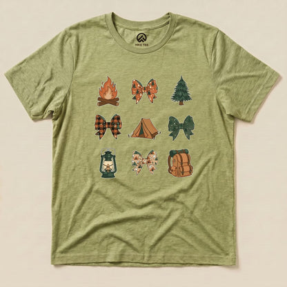 A green graphic t-shirt featuring various illustrated camping bows, including a campfire, lantern, and tent, labeled as "Camping Bows Shirt.