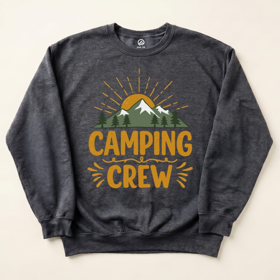 A dark gray "Camping Crew Sweatshirt" featuring a mountain scene, sun, and trees with the text "CAMPING CREW" prominently displayed.