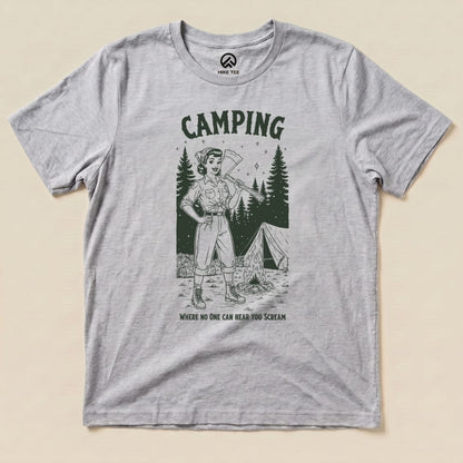 A gray graphic t-shirt featuring a vintage-style illustration of a camper with an axe and the slogan "Camping Where No One Can Hear You Scream.